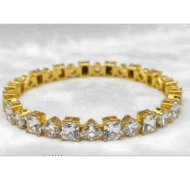 Gold color crystal bangle with alternating square and diamond geometric stones for artificial jewellery online shopping in Lahore.