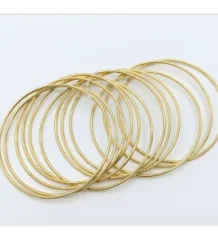 Gold color chooriyan bangles featuring thin metallic hoops for artificial jewellery online shopping in Lahore.