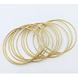 Gold color chooriyan bangles featuring thin metallic hoops for artificial jewellery online shopping in Lahore.
