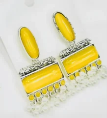 Yellow traditional drop earrings with silver color frames and hanging pearls for artificial jewellery shopping in Lahore.