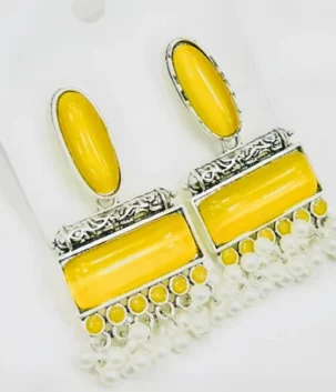 Yellow traditional drop earrings with silver color frames and hanging pearls for artificial jewellery shopping in Lahore.